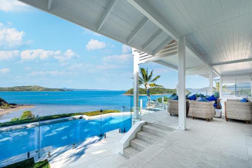 an exterior view of a house with a swimming pool at Whitsundays Bliss Luxury Whitsunday Ocean View Retreat in Shute Harbour
