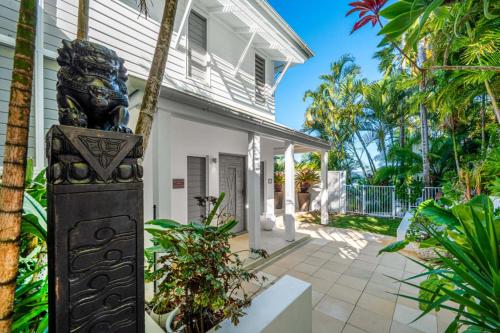 a statue in front of a house at Whitsundays Bliss Luxury Whitsunday Ocean View Retreat in Shute Harbour