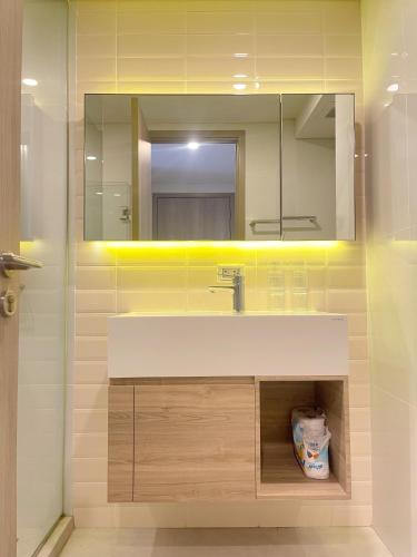a bathroom with a sink and a mirror at 2514 BTS OnNut Siamese 87 Two bedroom apartment in Bangkok