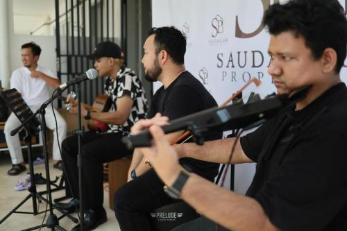 a group of men singing and playing instruments at SP Homestay Puncak Alam in Bandar Puncak Alam