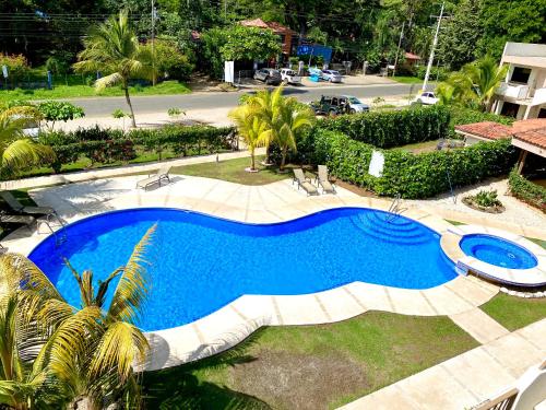 an overhead view of a swimming pool in a yard at Coco Cabana Ground Floor Condo in Coco