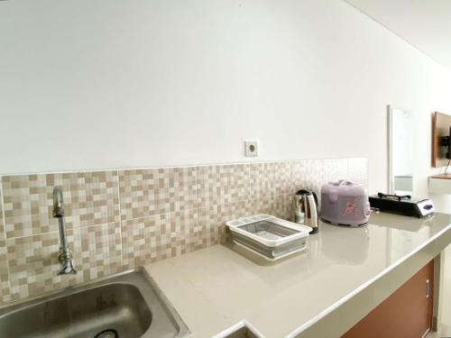 Kuchyň nebo kuchyňský kout v ubytování Comfort Stay Studio at Enviro Apartment By Travelio