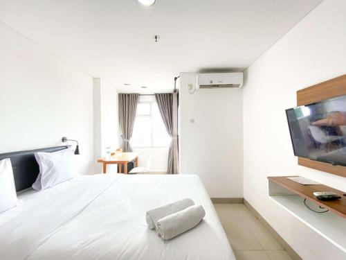 Katil atau katil-katil dalam bilik di Minimalist Studio at Enviro Apartment By Travelio