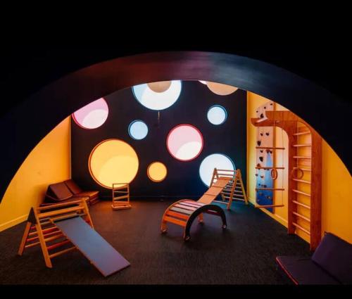 a room with a playroom with a room with a large window at Studio Sabana Secrt 3011 in San José
