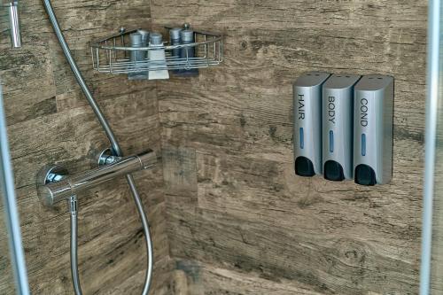 a bathroom with a shower with a shower head at Black Sea Resort in Primorskoye
