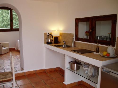 a kitchen with a sink and a counter top at Cortijo Los Malenos in Agua Amarga