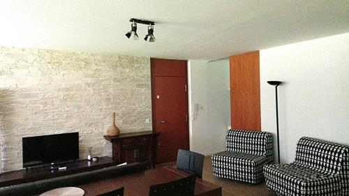 TV a/nebo společenská místnost v ubytování Milano 3 Astra Apartments & Rooms PT