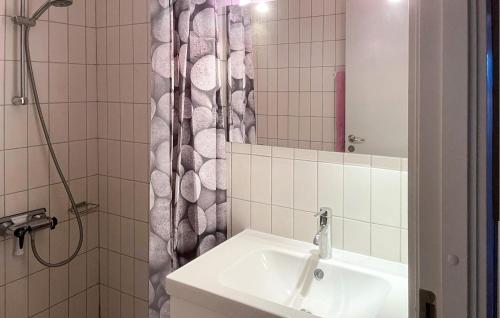 a bathroom with a sink and a shower at Apartment Skudehavnen in Rudkøbing