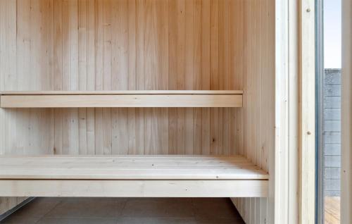 a wooden shelf in a sauna at Stunning Home In Ålbæk With Sauna in Ålbæk