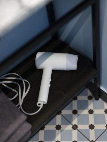 a roll of paper sitting on a table at MIRO Rooms Center - quiet chic, self check-in in Rīga