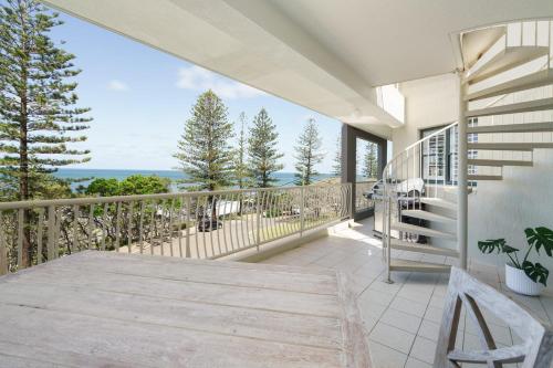 a balcony with a view of the ocean at Tranquil Tides Retreat - Coastal Waterfront Escape in Caloundra