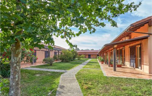 a courtyard of a building with a tree at Apt A21 in Grosseto