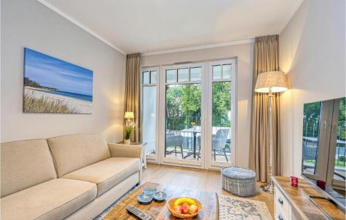 a living room with a couch and a table at Baltischer Hof Apartment 43 in Boltenhagen