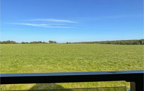a view of a field from a train window at Amazing Apartment In Østermarie in Østermarie