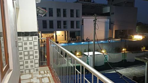 a view of a swimming pool at night at GB Guest House By ROH in Guwahati