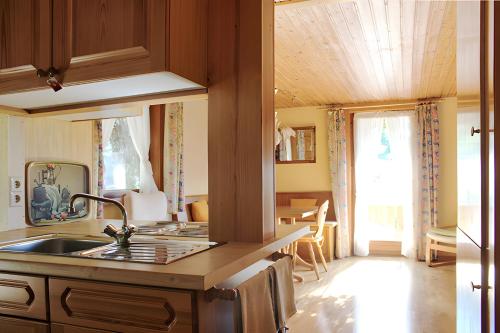 a kitchen with a sink and a counter top at Small holiday cottage Ivy in Schuttertal