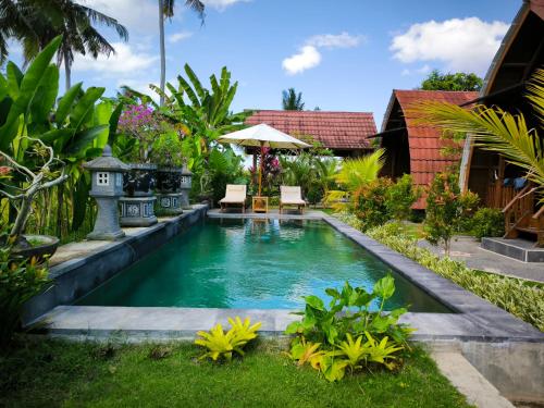 Bazén v ubytování Eling Ubud Guesthouse nebo v jeho okolí