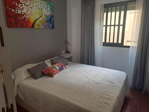 Postel nebo postele na pokoji v ubytování ISLA CANELA URBANIZACION ALCAUDON APARTAMENTO 50M PLAYA