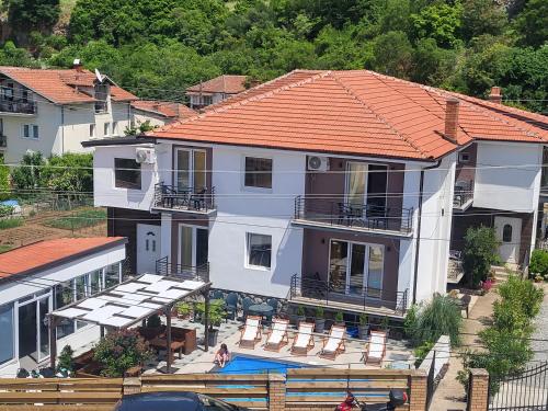 an aerial view of a house with a swimming pool at Villa Pegasus Pestani in Ohrid