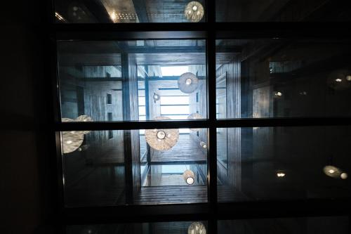 a view through a window of a room at Hotel Lux Santiago in Santiago de Compostela