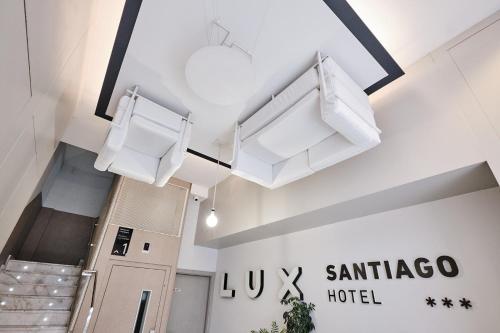 a hospital hallway with white towels hanging from the ceiling at Hotel Lux Santiago in Santiago de Compostela