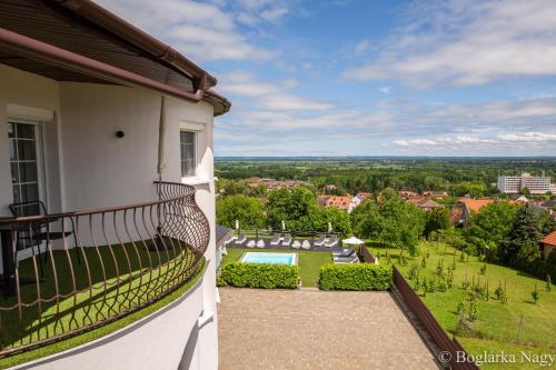 a balcony of a house with a view at Love and Dream Élményvilla in Zalakaros