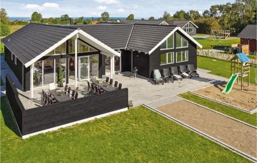 an overhead view of a house with a playground at Amazing Home In Nordborg With Sauna in Nordborg