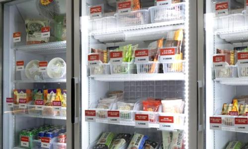 an open refrigerator filled with lots of food at Anyang ILLOWA Hotel in Anyang