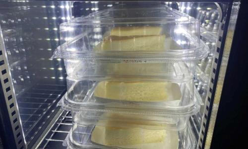 a plastic container of food in an open refrigerator at Anyang ILLOWA Hotel in Anyang