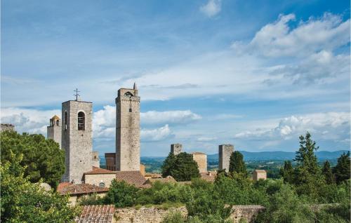 an old castle with two towers and a city at Piazzale 1 in Castellina in Chianti