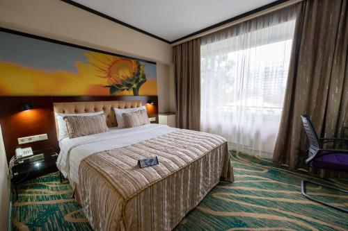 Katil atau katil-katil dalam bilik di Hotel Kazzhol Almaty
