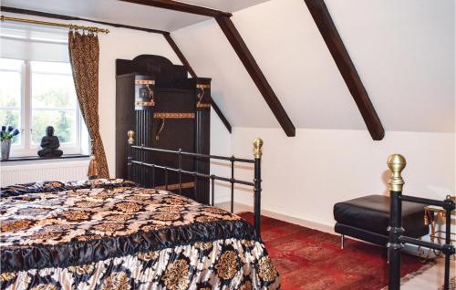 a bedroom with a bed and a window at Lovely Home In Klippan With Sauna in Klippan