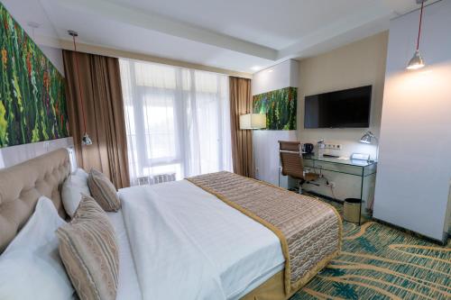 Katil atau katil-katil dalam bilik di Hotel Kazzhol Almaty