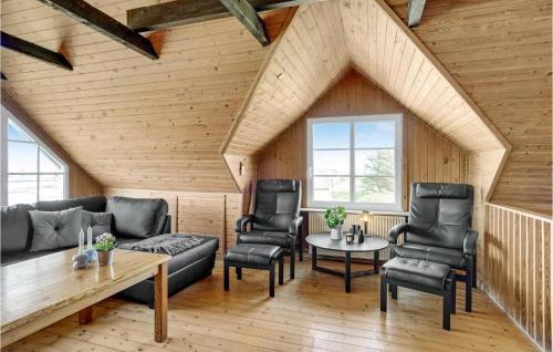 a living room with a couch and chairs and a table at 3 Bedroom Cozy Home In Fjerritslev in Fjerritslev