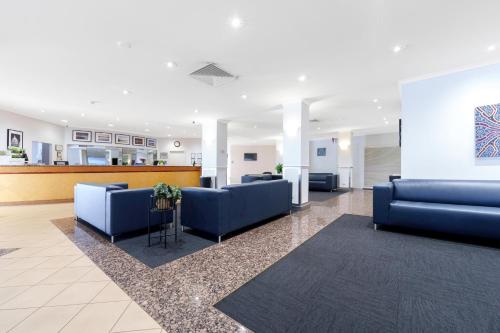 a lobby with blue couches in a hospital at Comfort Inn & Suites Goodearth Perth in Perth
