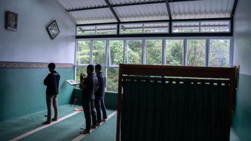 a group of people standing in a room looking out a window at Leuweung Geledegan Ecoldge in Kiarapayung 2