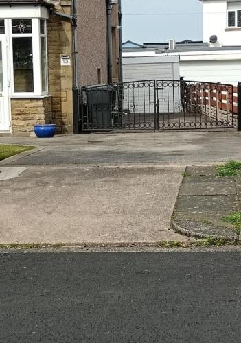 an empty street in front of a building at Sea View in Heysham