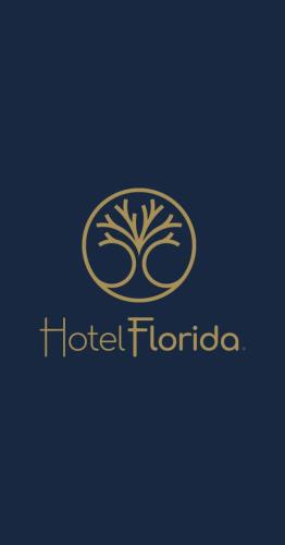a logo for a hotel florida with a tree at Hotel Florida in Ambato