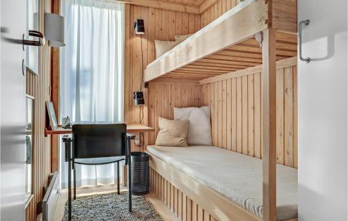 a small bedroom with a bunk bed and a desk at 3 Bedroom Lovely Home In Knebel in Knebel