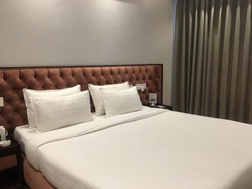 Postel nebo postele na pokoji v ubytování Hotel Accord Premier