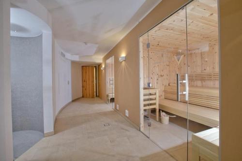 a hallway with a glass shower in a house at Residenz Wildkogelbahnen Top 18 in Neukirchen am Großvenediger