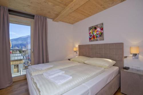 Postel nebo postele na pokoji v ubytování Residenz Wildkogelbahnen Top 21
