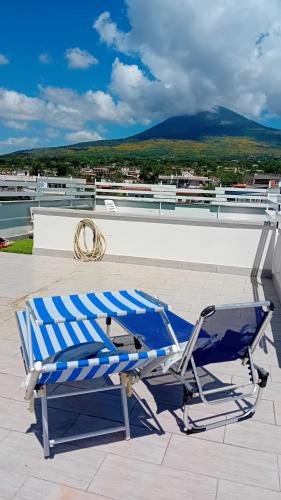 a blue and white chair sitting on a roof at Casa di Nonna Margherita in Trecase