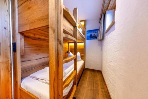 a bunk bed room with two bunk beds at Haus Wildkarblick Top 6 in Nothdorf
