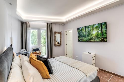 a bedroom with a bed and a couch and a window at 3Storie Vatican St Peter in Rome