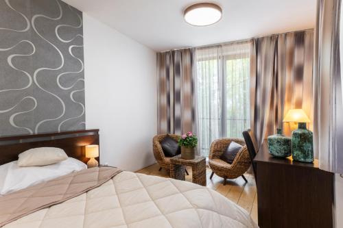 Postel nebo postele na pokoji v ubytování Archa hotel