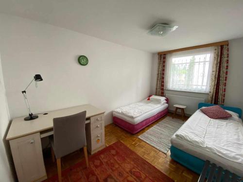 a room with a desk and a bed and a desk and a desk at Holiday Home Ilidza Ella in Sarajevo