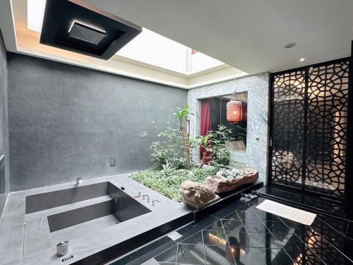 a kitchen with a sink in a room at Orient Luxury Villa Motel in Huwei