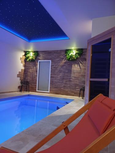 a swimming pool in a house at Bélénos - Suites & Spa in Bligny-sur-Ouche