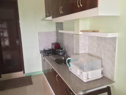 a kitchen with a sink and a counter top with a sink at Ocean View Apartment-Near Blood Compact Shrine in Tagbilaran City